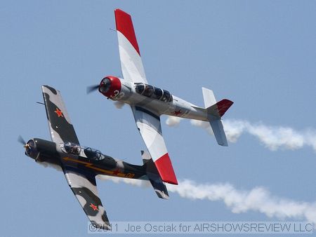 Yak-52 trainers performing over Millville.
